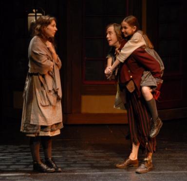 (L-R) Caroline Bower, Ben Mackel and Emily Calder star in Childrens Theatre of Charlottes world premiere production of The Christmas Doll. Photo by Donna Bise.