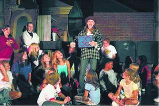 Monica Nelson of Redford (center) is one of two girls playing the part of Brundibar in the children's opera by Motor City Youth Theatre. The show opens Friday, Oct. 17, at the Grantland Street Playhouse in Livonia.